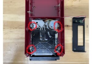 Remove the four disk drive screws