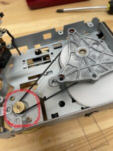 Hook the rubber onto the motor side